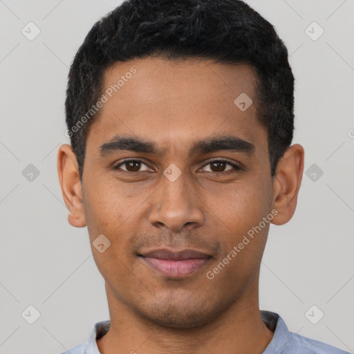 Joyful latino young-adult male with short  black hair and brown eyes