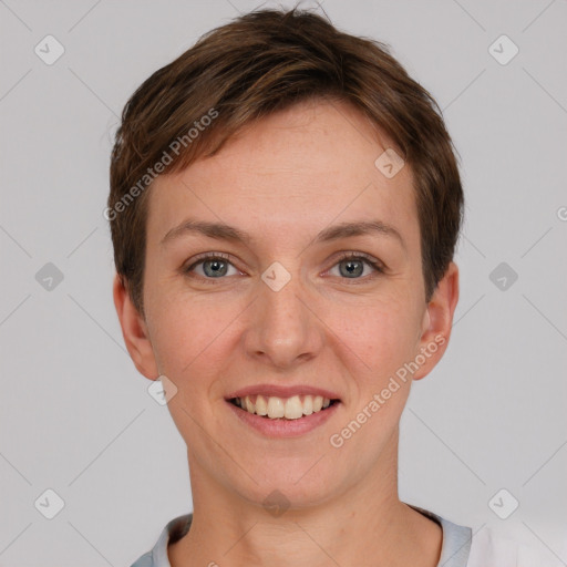 Joyful white young-adult female with short  brown hair and grey eyes