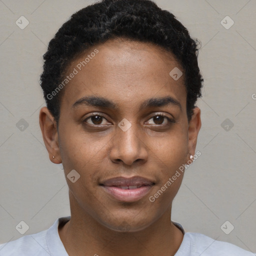 Joyful black young-adult male with short  black hair and brown eyes