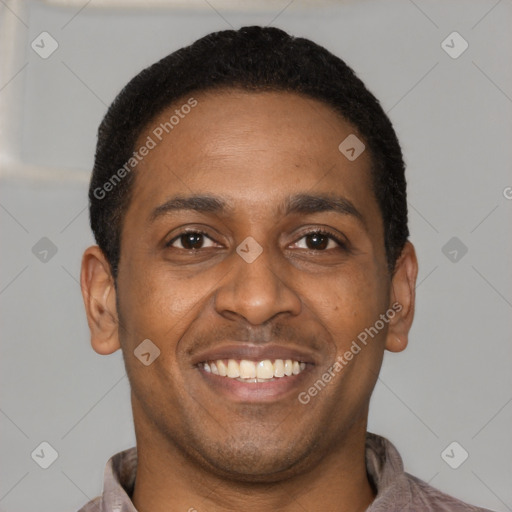 Joyful latino young-adult male with short  brown hair and brown eyes