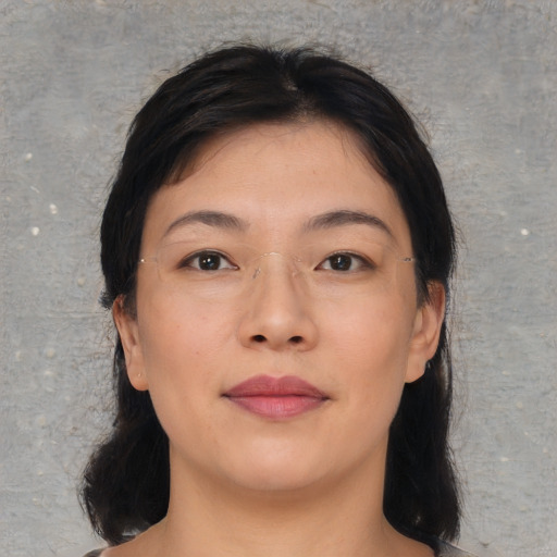 Neutral asian young-adult female with medium  brown hair and brown eyes