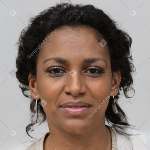 Joyful black adult female with medium  brown hair and brown eyes
