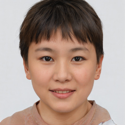 Joyful asian child female with short  brown hair and brown eyes