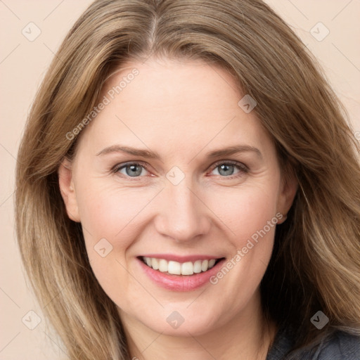 Joyful white young-adult female with long  brown hair and grey eyes