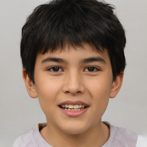 Joyful white child male with short  brown hair and brown eyes