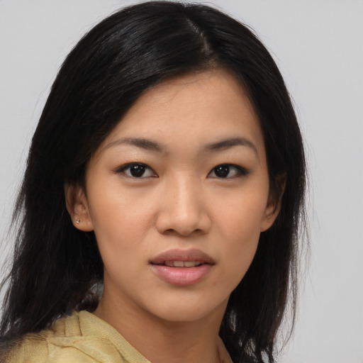 Joyful asian young-adult female with medium  black hair and brown eyes