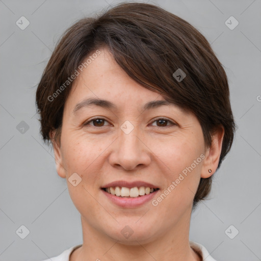 Joyful white adult female with medium  brown hair and brown eyes