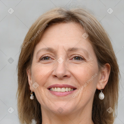 Joyful white adult female with medium  brown hair and grey eyes