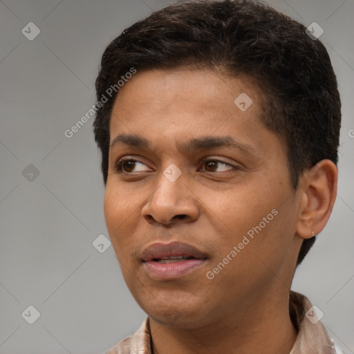 Joyful black young-adult male with short  brown hair and brown eyes