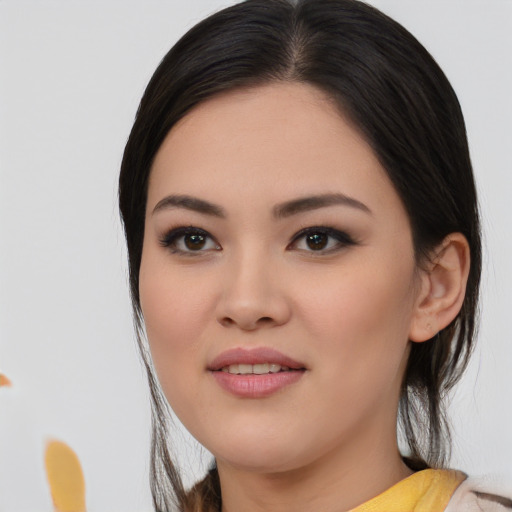 Joyful asian young-adult female with medium  black hair and brown eyes