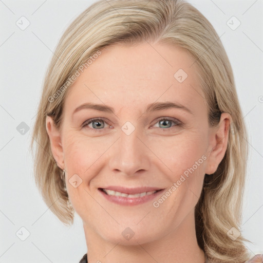 Joyful white young-adult female with medium  brown hair and blue eyes