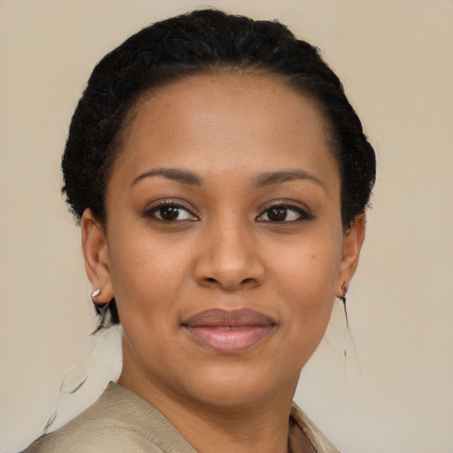 Joyful black young-adult female with short  brown hair and brown eyes