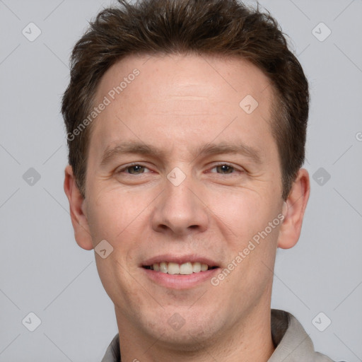 Joyful white adult male with short  brown hair and brown eyes