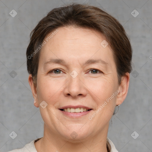 Joyful white adult female with short  brown hair and brown eyes