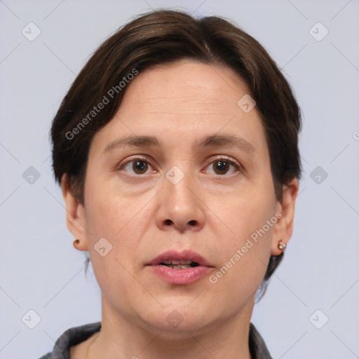 Joyful white adult female with short  brown hair and brown eyes