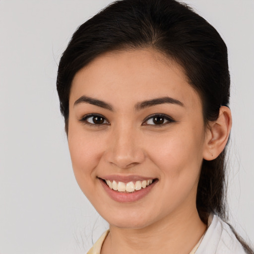 Joyful white young-adult female with medium  brown hair and brown eyes