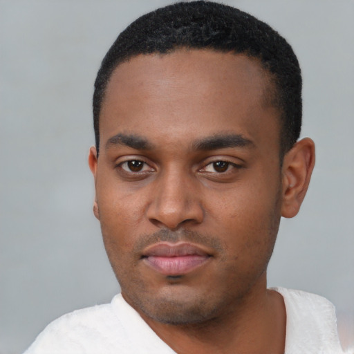 Neutral latino young-adult male with short  black hair and brown eyes