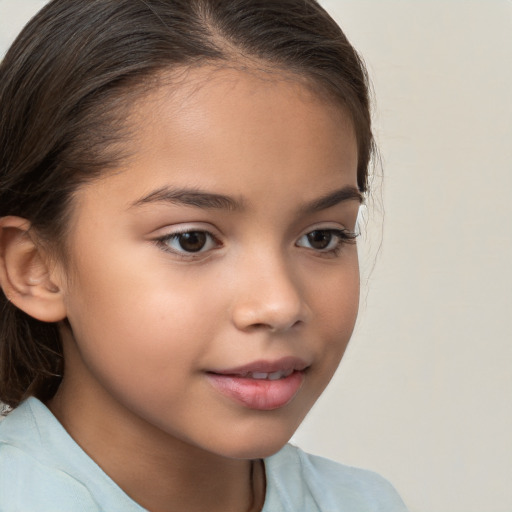 Joyful white child female with medium  brown hair and brown eyes