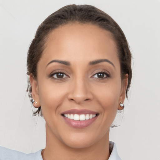 Joyful white young-adult female with short  brown hair and brown eyes