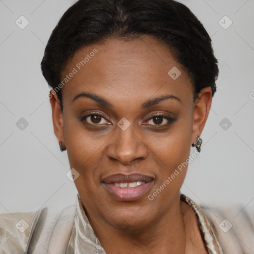 Joyful black young-adult female with short  brown hair and brown eyes