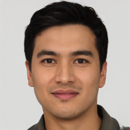 Joyful asian young-adult male with short  black hair and brown eyes