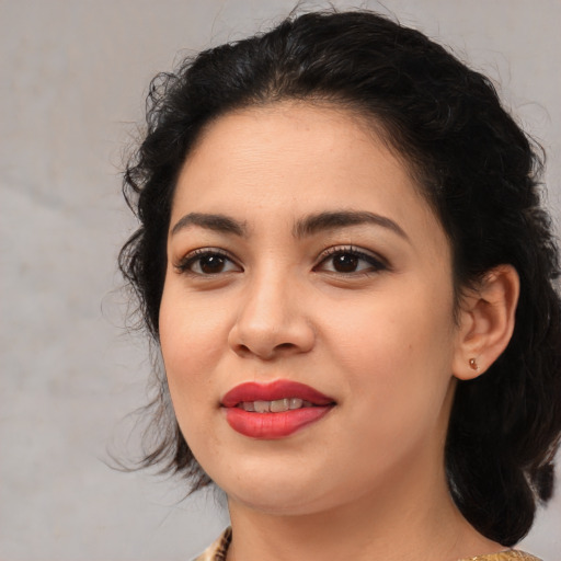 Joyful asian young-adult female with medium  brown hair and brown eyes