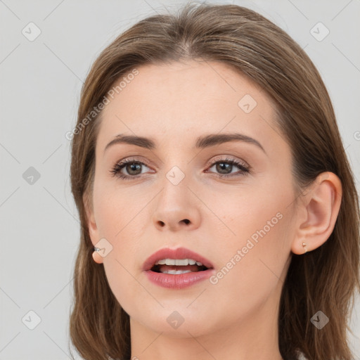 Joyful white young-adult female with long  brown hair and grey eyes