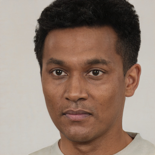 Neutral black young-adult male with short  black hair and brown eyes