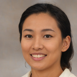 Joyful asian young-adult female with medium  brown hair and brown eyes