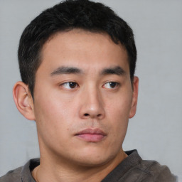 Neutral asian young-adult male with short  brown hair and brown eyes