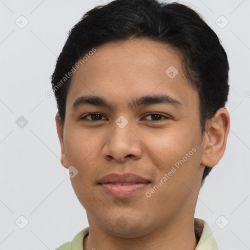 Joyful latino young-adult male with short  brown hair and brown eyes