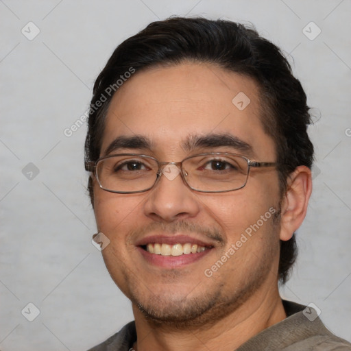 Joyful white adult male with short  black hair and brown eyes