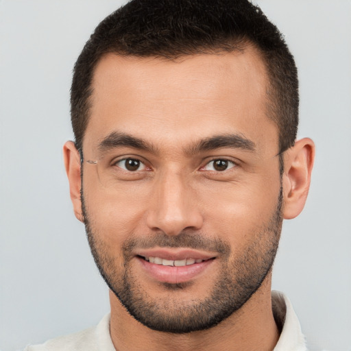 Joyful white young-adult male with short  brown hair and brown eyes