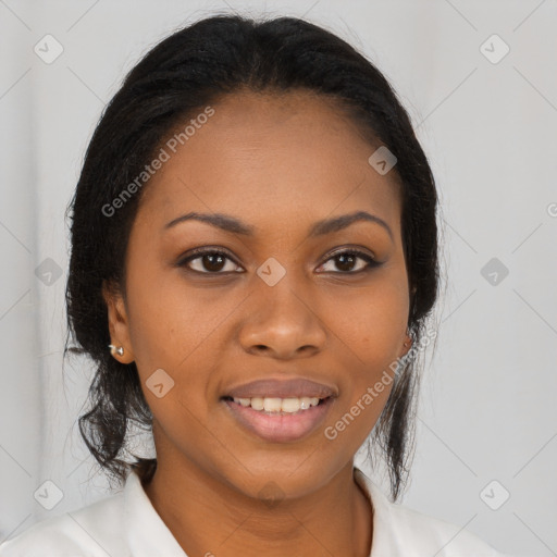 Joyful black young-adult female with long  brown hair and brown eyes