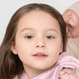 Joyful white child female with medium  brown hair and blue eyes