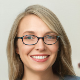 Joyful white young-adult female with long  brown hair and blue eyes