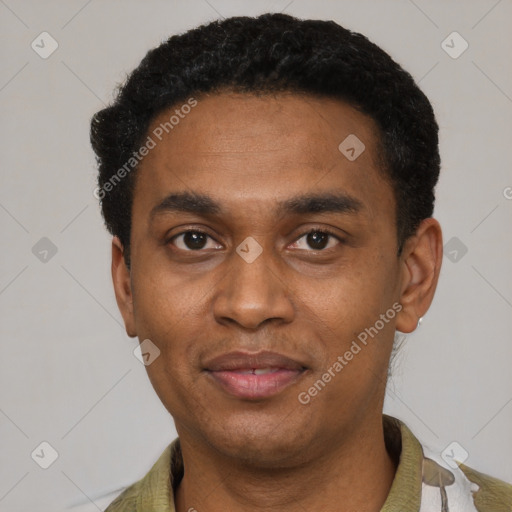 Joyful black adult male with short  black hair and brown eyes