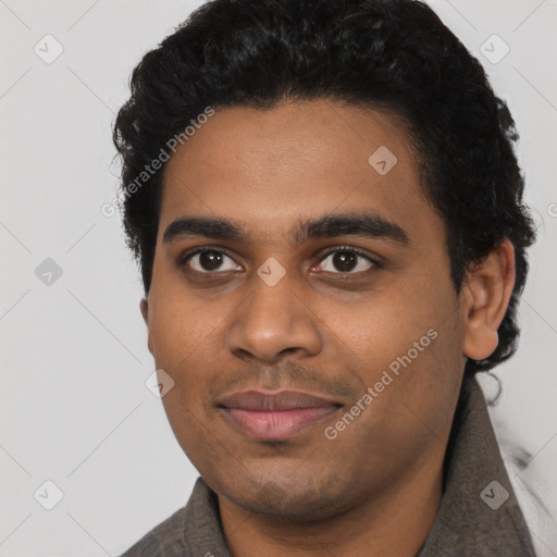 Joyful black young-adult male with short  black hair and brown eyes