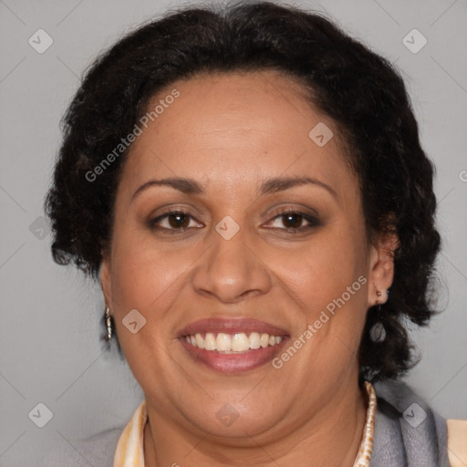 Joyful latino adult female with medium  brown hair and brown eyes