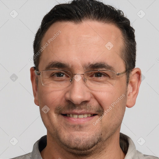 Joyful white adult male with short  brown hair and brown eyes