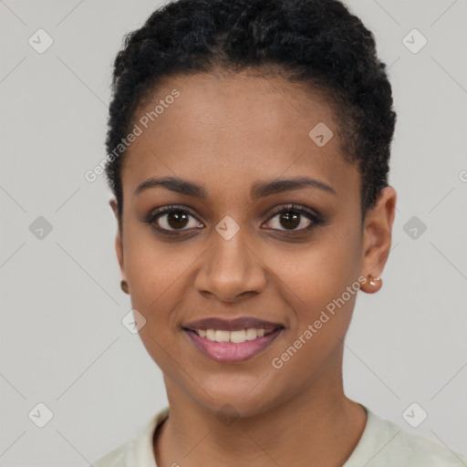 Joyful black young-adult female with short  black hair and brown eyes