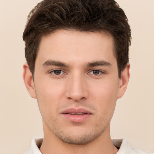 Neutral white young-adult male with short  brown hair and brown eyes