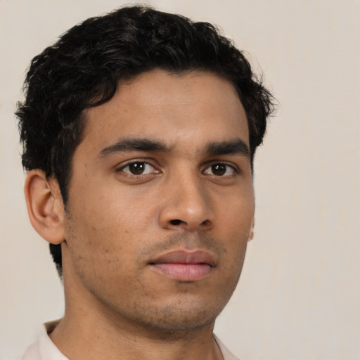 Neutral latino young-adult male with short  brown hair and brown eyes
