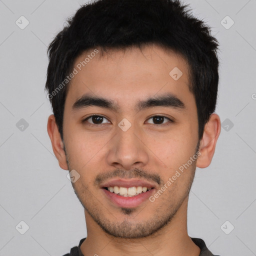 Joyful asian young-adult male with short  black hair and brown eyes