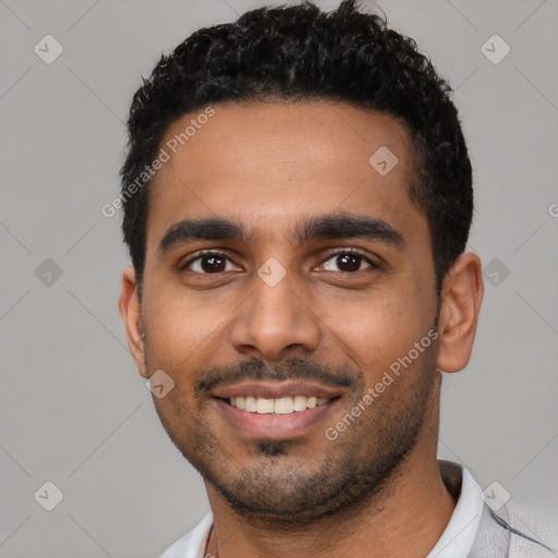 Joyful latino young-adult male with short  black hair and brown eyes