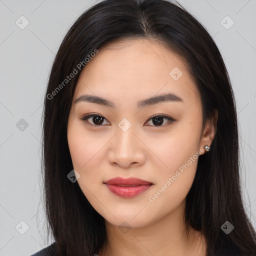 Joyful asian young-adult female with long  brown hair and brown eyes