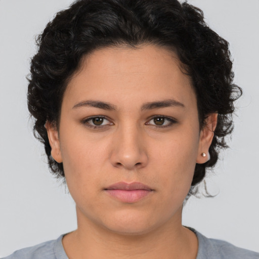 Neutral white young-adult female with short  brown hair and brown eyes
