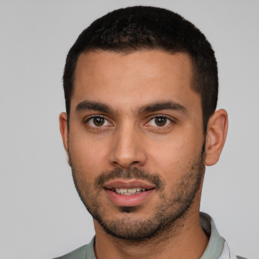 Joyful white young-adult male with short  black hair and brown eyes