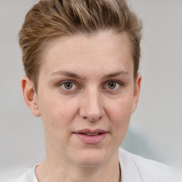 Joyful white young-adult female with short  brown hair and grey eyes