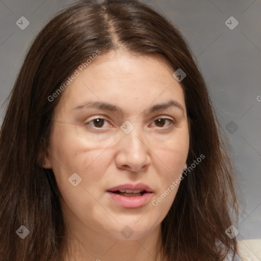 Joyful white adult female with medium  brown hair and brown eyes